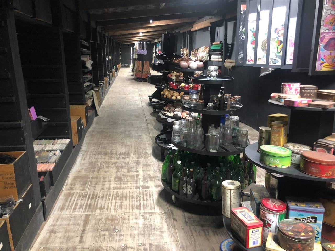The All Sorts room at Shongweni, shelves and stands full along its whole length